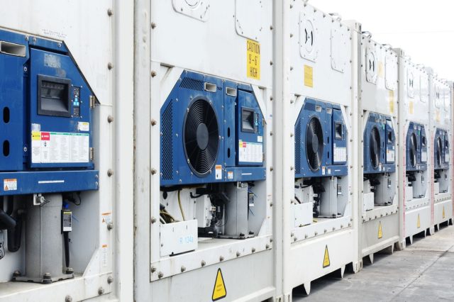 line of reefer shipping containers with motors on show